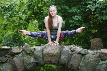 Beautiful gymnast exercise outdoorの写真素材