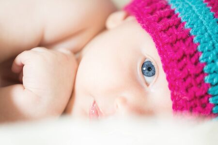 Cute infant with sad eyesの写真素材