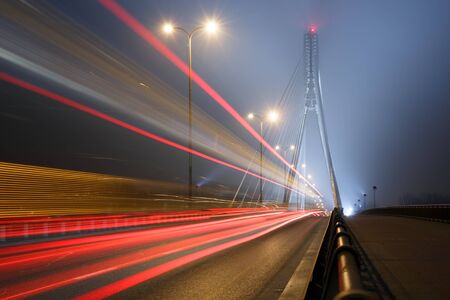 Suspension bridge in the fog and speed lines. Bridge Swietokrzyskiの写真素材
