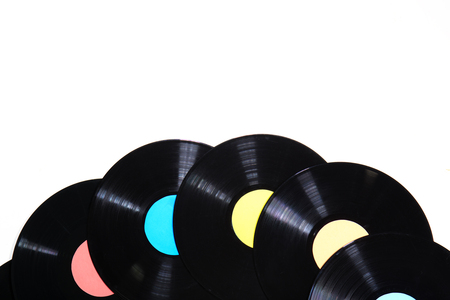Old used vinyl record on a white backgroundの写真素材