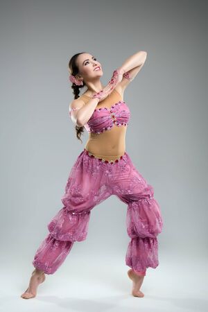 Beautiful young woman in ethnic attire in the studioの写真素材