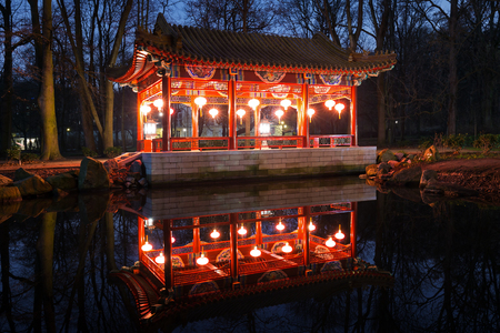 Traditional Chinese pavilions in Lazienki Park in Warsaw at nightのeditorial素材