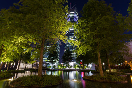 Office buildings in Warsaw at nightの写真素材