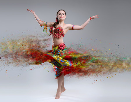 Dancer with disintegrating dress. Abstract vision.Photo manipulation