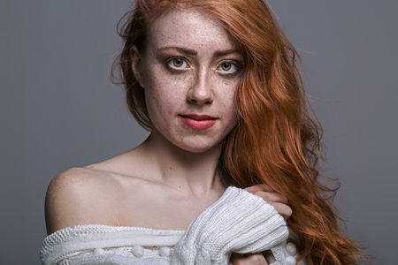 Portrait of a charming redheaded freckled womanの写真素材
