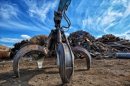 Gripper excavator on a scrap yard. HDR - high dynamic rangeの写真素材
