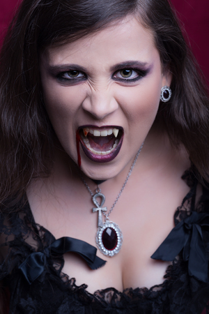 Halloween, portrait of a beautiful vampire womanの写真素材