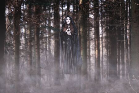 Witch levitating in the forestの写真素材
