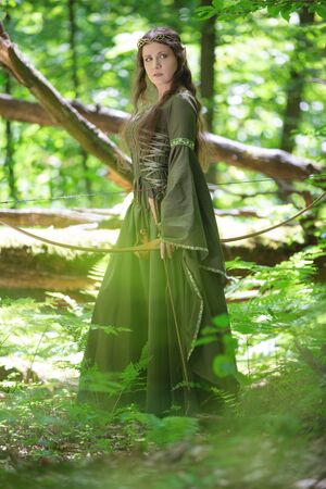 Elf archer with a bow in the forestの写真素材