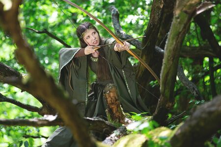 Elf archer with a bow in the forestの写真素材