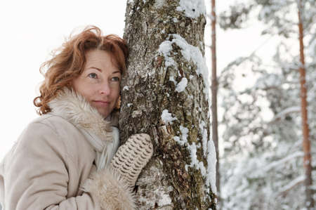 Portrait of  thoughtful red-haired woman in winters day.の写真素材