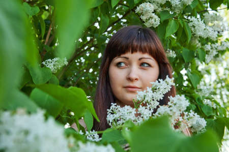 Portrait of young beautiful woman with pipe-tree.の写真素材