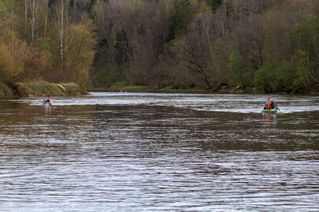People boating on river Gauja in Latvia, peacefull nature scene.のeditorial素材