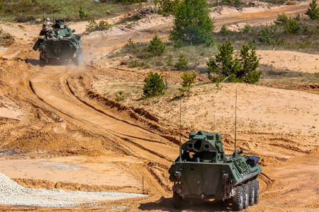 NATO soldiers and military vehicles. International Military Training Saber Strike 2017, Adazi,...