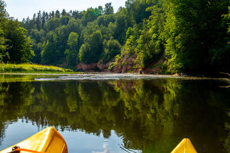 Kayak and canoe ride in river Gauja in Latvia. Boat ride by the river. Beautiful view of river from...
