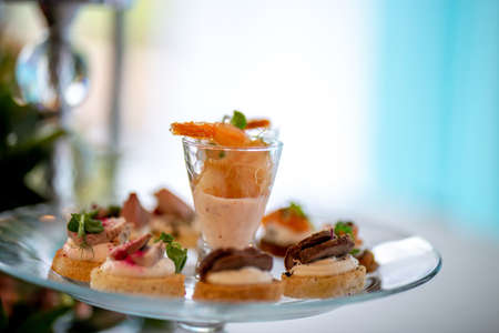 Glass of shrimp salad and sandwiches on the wedding table. Shrimp salad and sandwiches on festive...