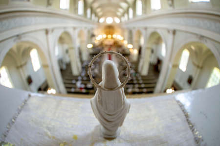 Statue of Virgin Mary from behind. Riga St. Albert Roman Catholic congregation, Roman Catholic Church in Riga, Latvia. Interior of the Roman Catholic Church.のeditorial素材