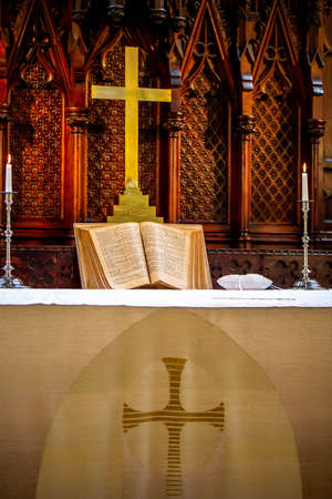 Riga, Latvia - May 18, 2018. Riga Luther Church. Church altar with cross and bible before wedding ceremony. Open bible on altar before worship. Interior of church.のeditorial素材