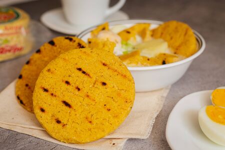 Egg broth with arepa of corn pelao. Typical Colombian breakfast (arepa Santandereana)