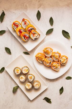 sushi of different flavors. with local Colombian ingredients. Served on different platesの写真素材