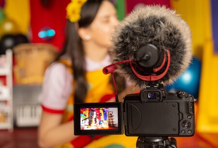 woman recording video for  channel with children's programの写真素材