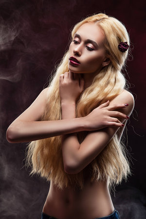 portrait of a girl in studio, blonde with long hairの写真素材