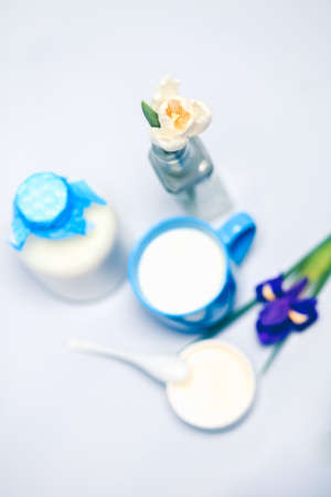 Still life with milk, dairy products,flowers, white tulipsの写真素材