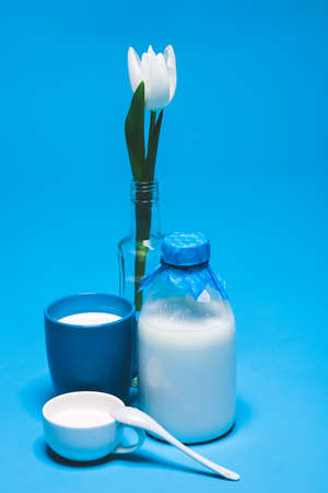 Still life with milk, dairy products,flowers, white tulipsの写真素材