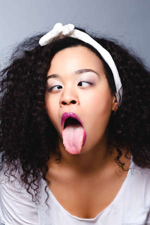 portrait of real funny face african womanの写真素材