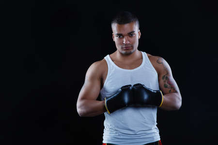 Young African American Boxer screaming isolated on a dark backgroundの写真素材