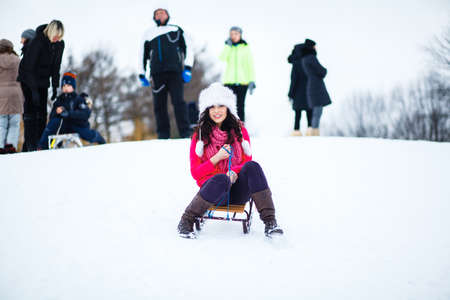 portrait of a beautiful, cheerful girl in winterの写真素材