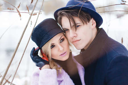 Happy Young Couple in Winter Park having fun.Family Outdoors. loveの写真素材