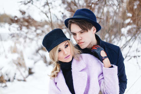 Happy Young Couple in Winter Park having fun.Family Outdoors. loveの写真素材