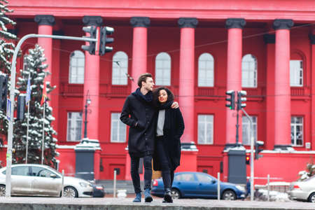 loving couple in a winter day in the city,African girl  and caucasian man