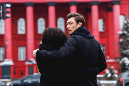loving couple in a winter day in the city,  and caucasian manの写真素材