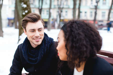 loving couple in a winter day in the city,African girl  and caucasian manの写真素材