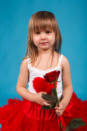 little cute girl with a bouquet of rosesの写真素材