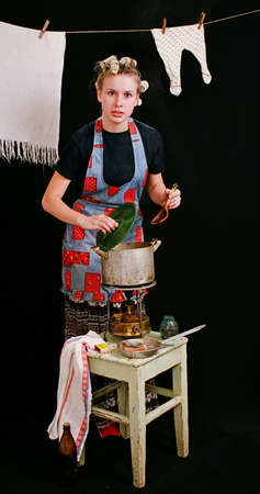 Typical everyday woman cooking in kitchen 1の写真素材