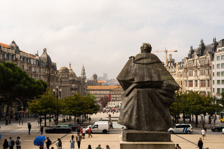 Statue in Porto Square with the city backの写真素材
