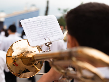 Musician playing the trombone from seen behindの写真素材