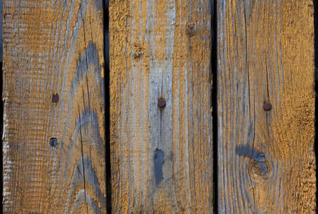Vintage wood background with peeling paint. yellow color.の写真素材
