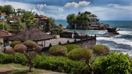 tanalot temple at sunset in eastern Bali, Indonesiaの写真素材