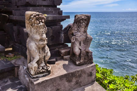 Hindu statue near to enter a sacred place. overlooking the ocean . Bali island. indonesiaの写真素材