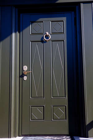 dark green wooden door in the houseの写真素材