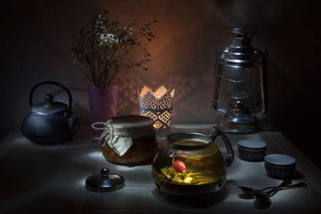 Tea ceremony. flower blooming in Glass teapotの写真素材