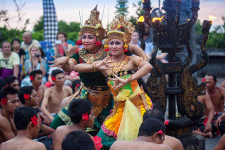 Bali, Indonesia - March 03, 2013: Kecak dance is a traditional ritual of Bali, Indonesia.This dance is being shown at Uluwatu Temple.Blurred appearance of flowing dance.のeditorial素材