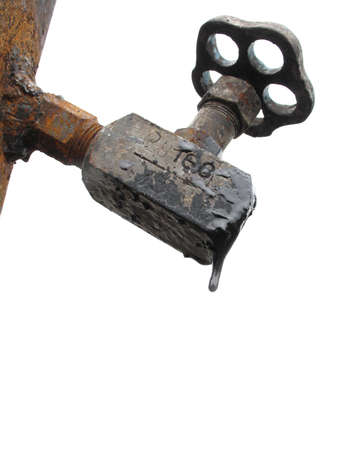 old metal pipe with valve on white backgroundの写真素材