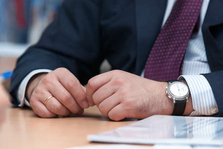 Businessman , sitting at his desk in office, Hands close-up