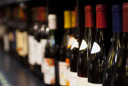 various bottles of wine on the shelf. selective focus