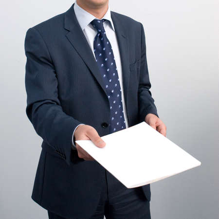 Businessman in suit with folder of documents. closeupの写真素材